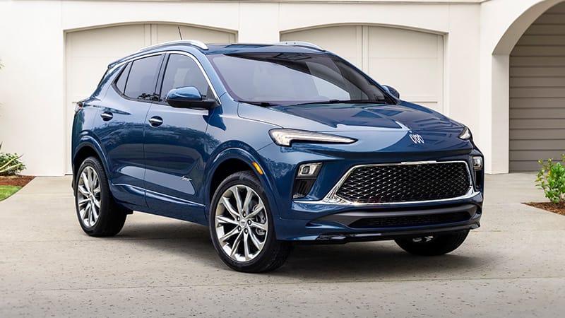 The New 2024 Buick Encore Gx In A Beautiful Blue Color, Standing At An Angle Mostly Facing The Camera Is Among The Safest Cars On The Road