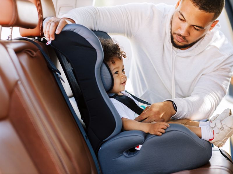 Car Seat Being Installed Into A Car