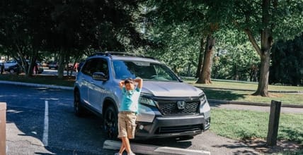 Child In Front Of Honda Passport