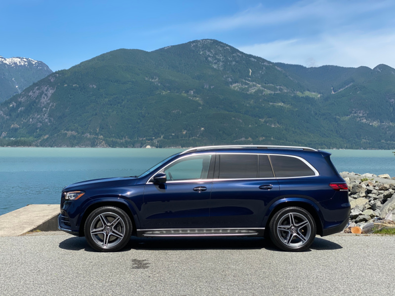 Blue Mercedes-Benz Gls 450 With Oceans And Mountains In The Background 