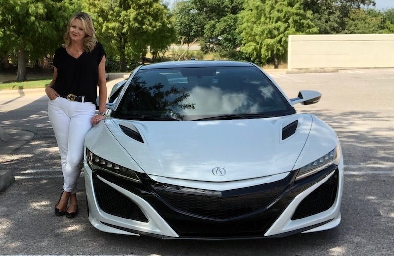 Woman Happily Leaning On A White Sports Car 