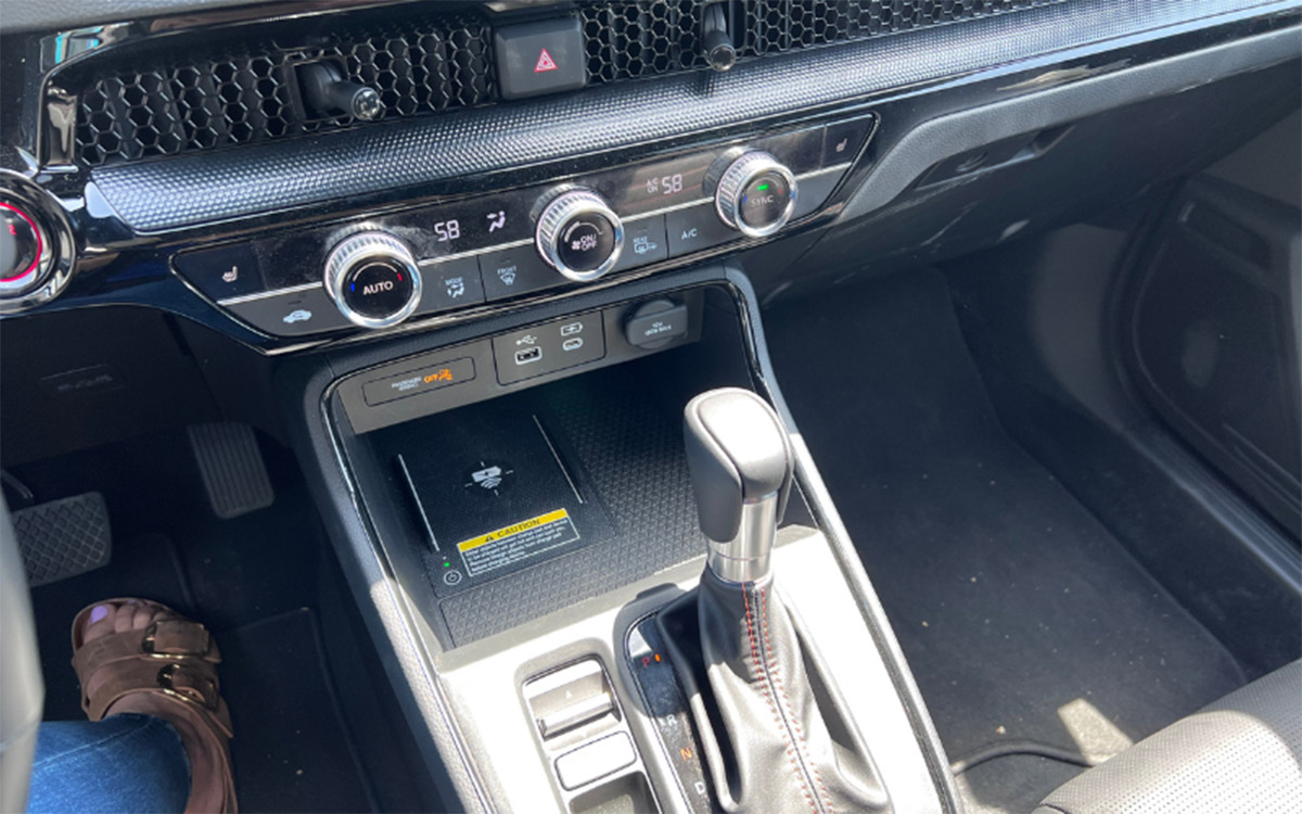 Some Of My Favorite Things Large Wireless Charging Pad, Big Box Of Space For Passengers_ Legs And Honeycomb-Like Design Pattern Over The Vents. Photo By Allison Bell