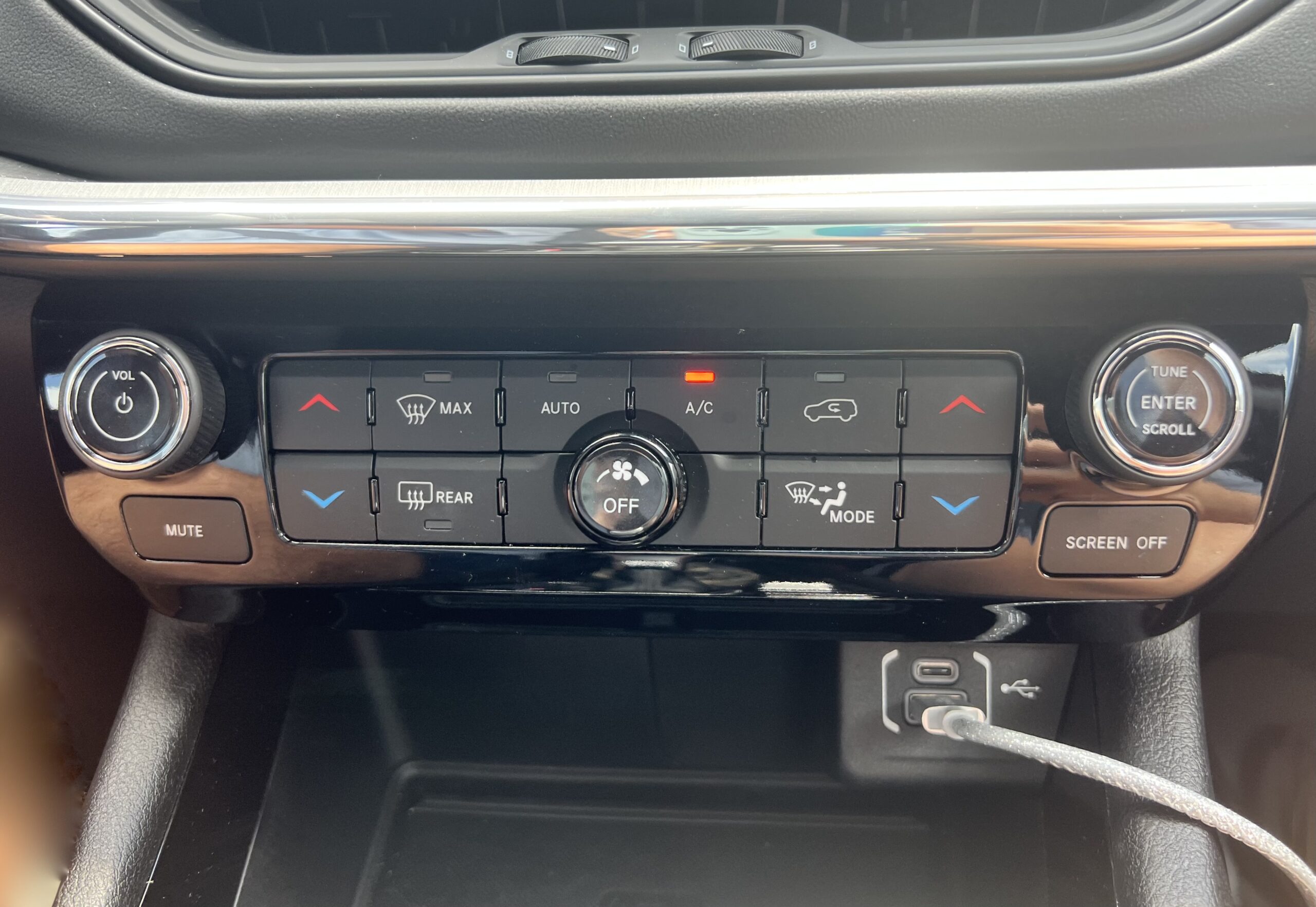 The Climate Control Panel Is Right Below The Air Vents And Below That, A Storage Cubby And Usb-C Ports