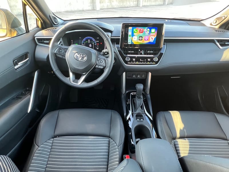 The Front Seat Of The 2023 Toyota Corolla Cross Hybrid Compact Suv