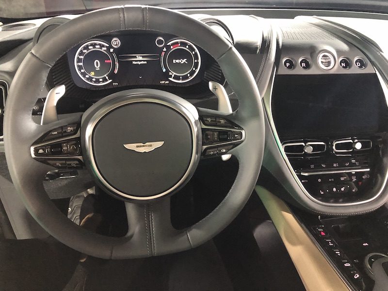 The Black Steering Wheel And Interior Of Aston Martin Dbx