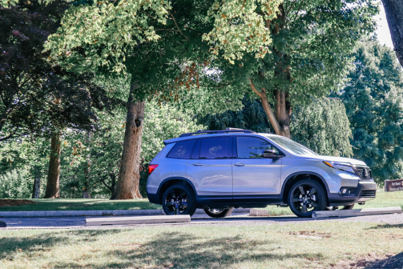 Sideview Of A Parked Two-Row Honda Passport 